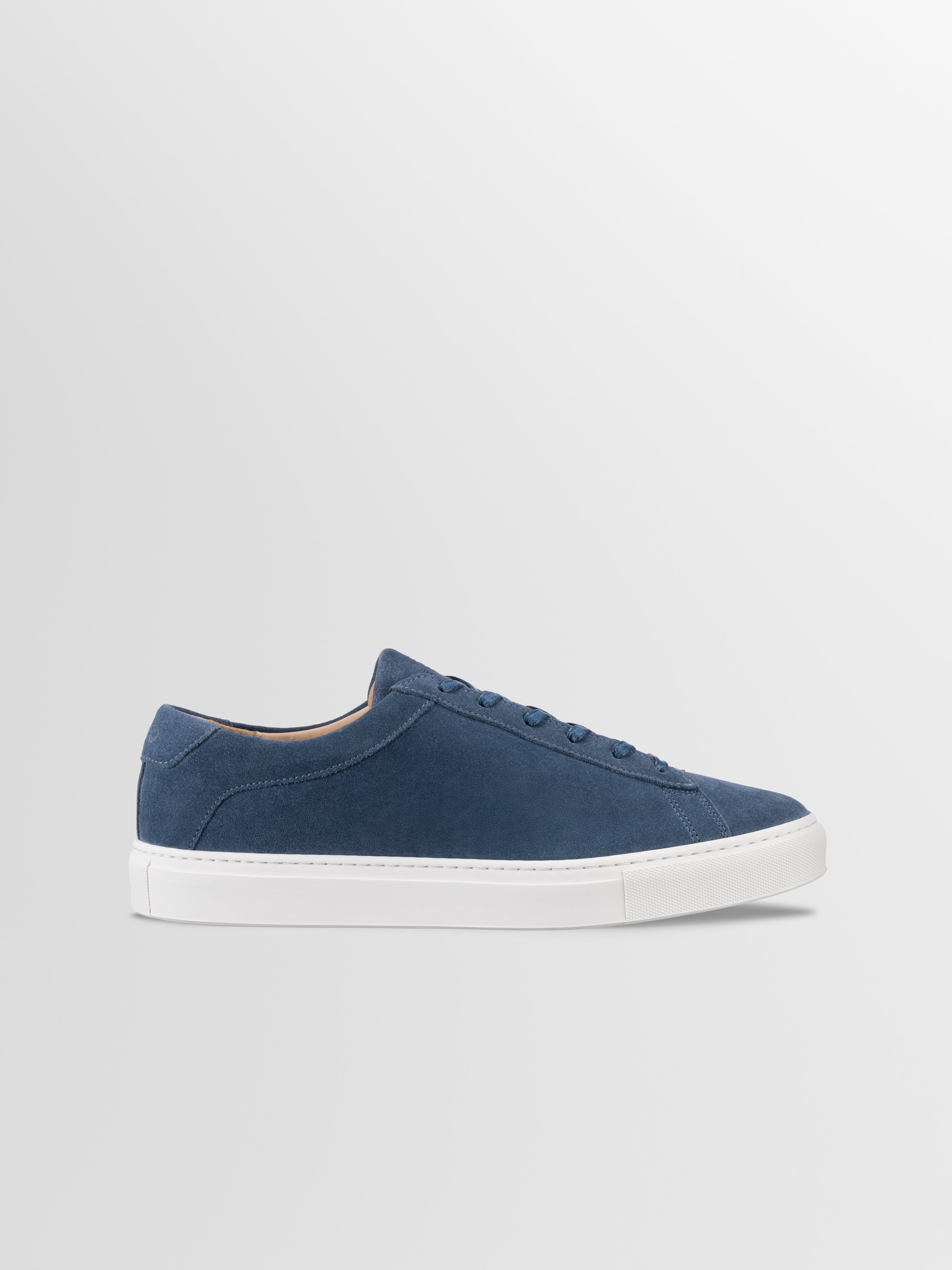 Blue suede sneaker with matching laces and white rubber sole
