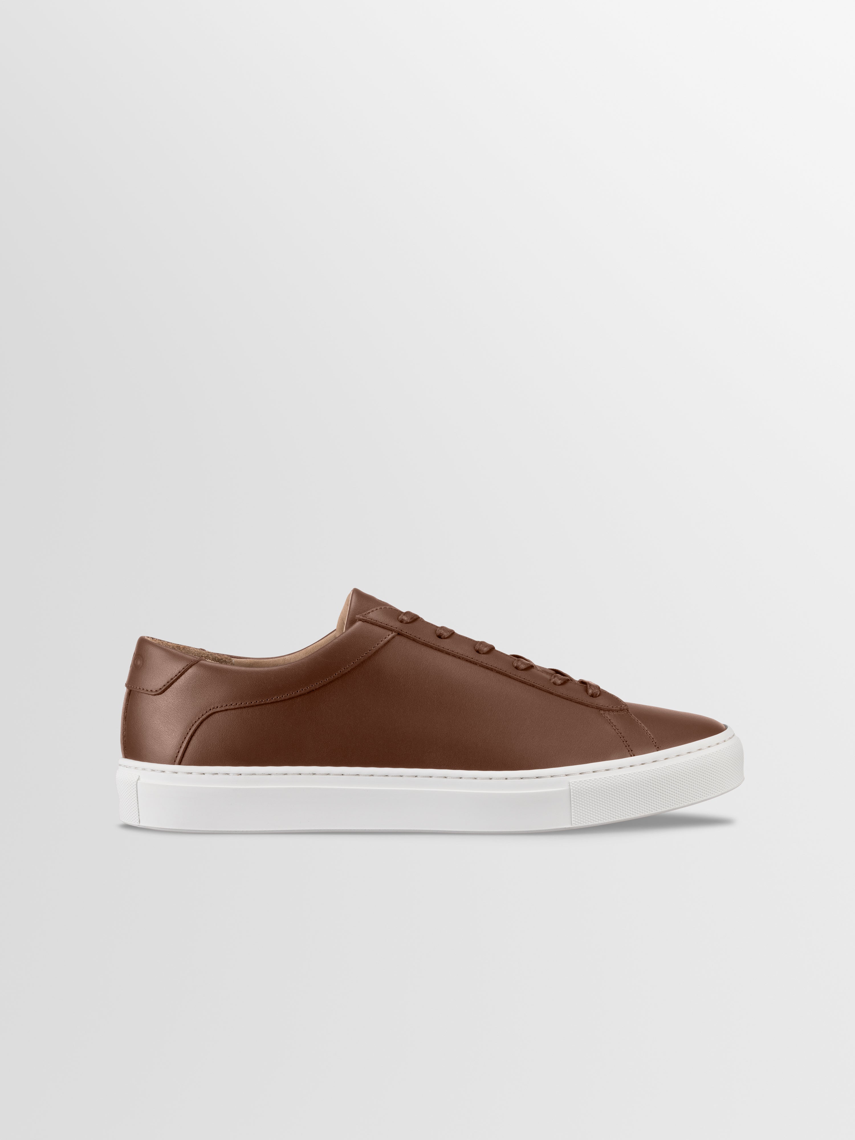 Brown leather sneaker with matching laces and white rubber sole