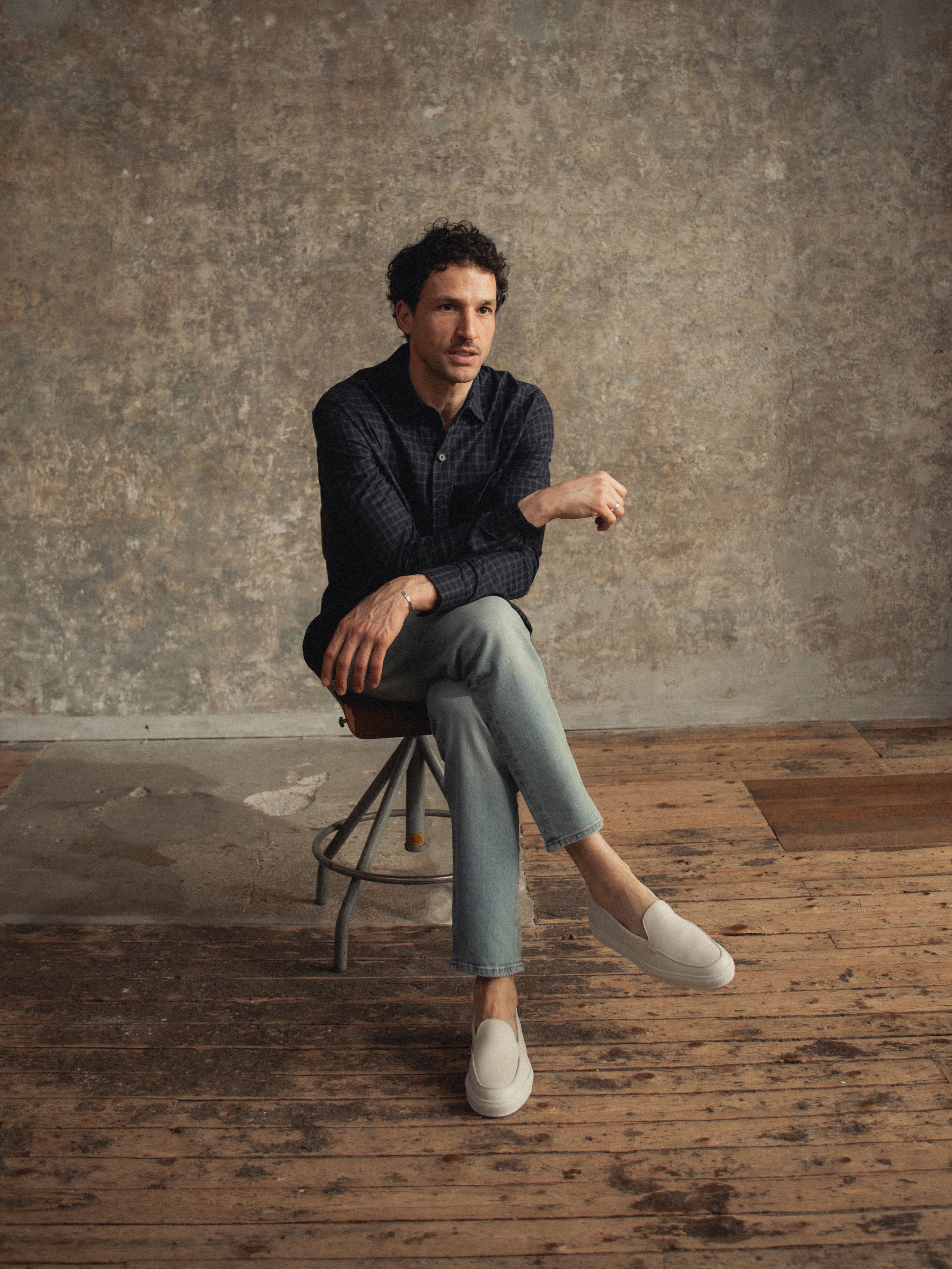 Man sitting wearing Men